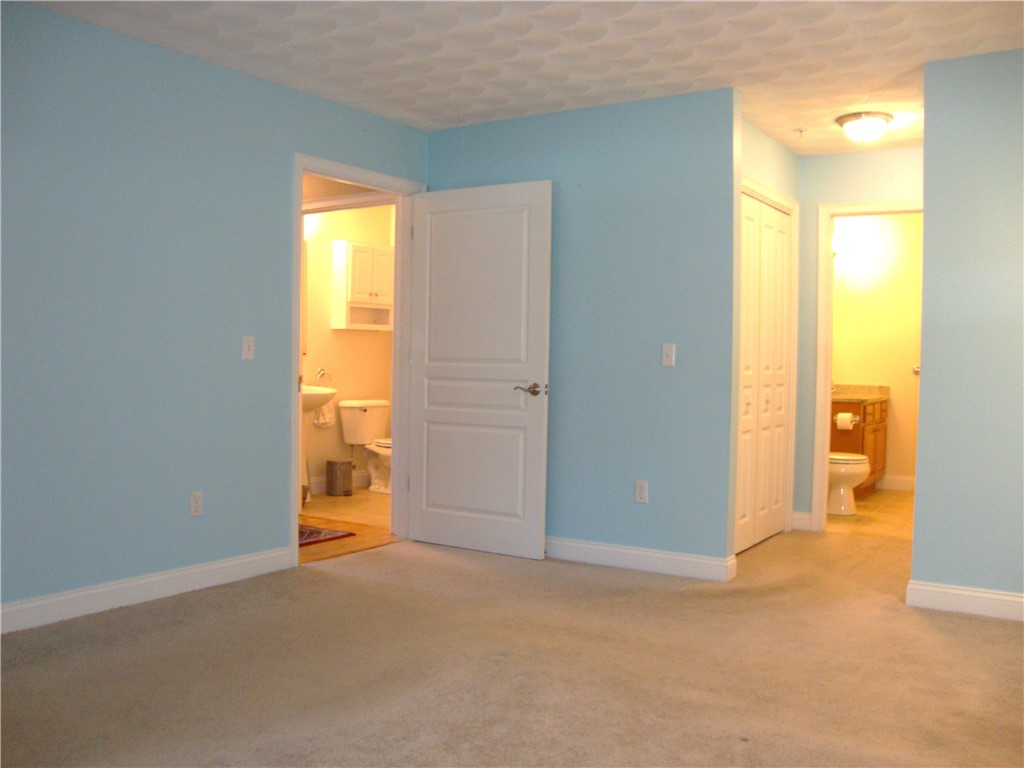 1780 Nooseneck Hill Road, Unit 11D Coventry, RI 02816 - Photo 17 of 24 location of bathrooms from master bedroom