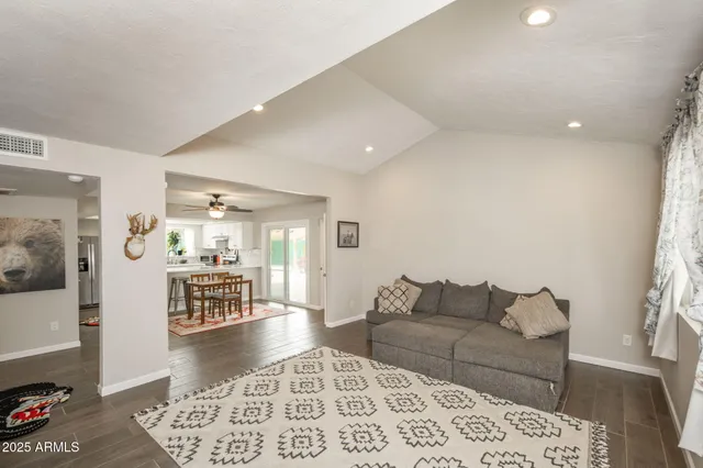 a living room with furniture and a rug