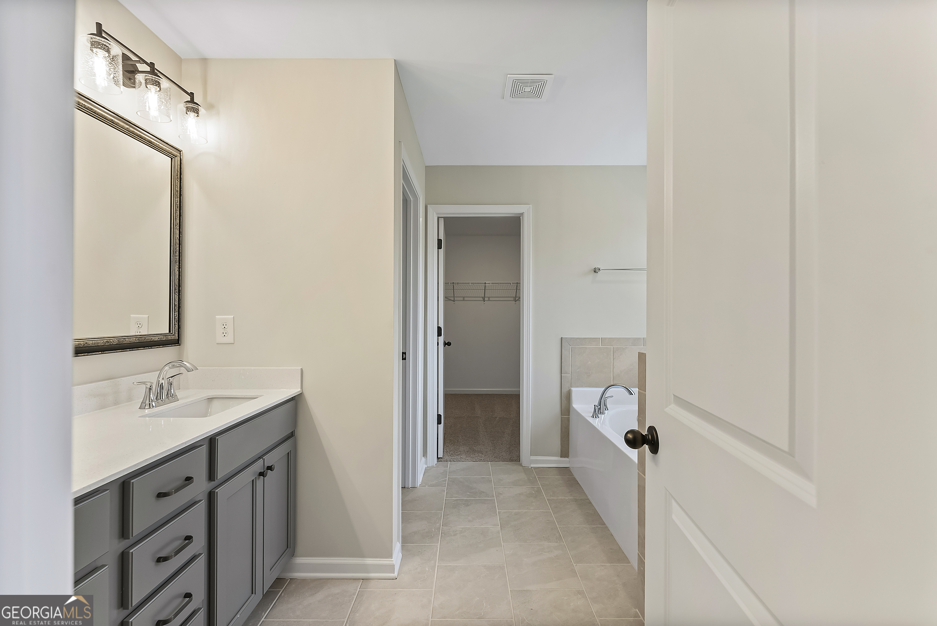 575 Mountain View Drive, Unit 17B Hamilton, GA 31811 - Photo 15 of 34 a spacious bathroom with a double vanity sink a mirror and a