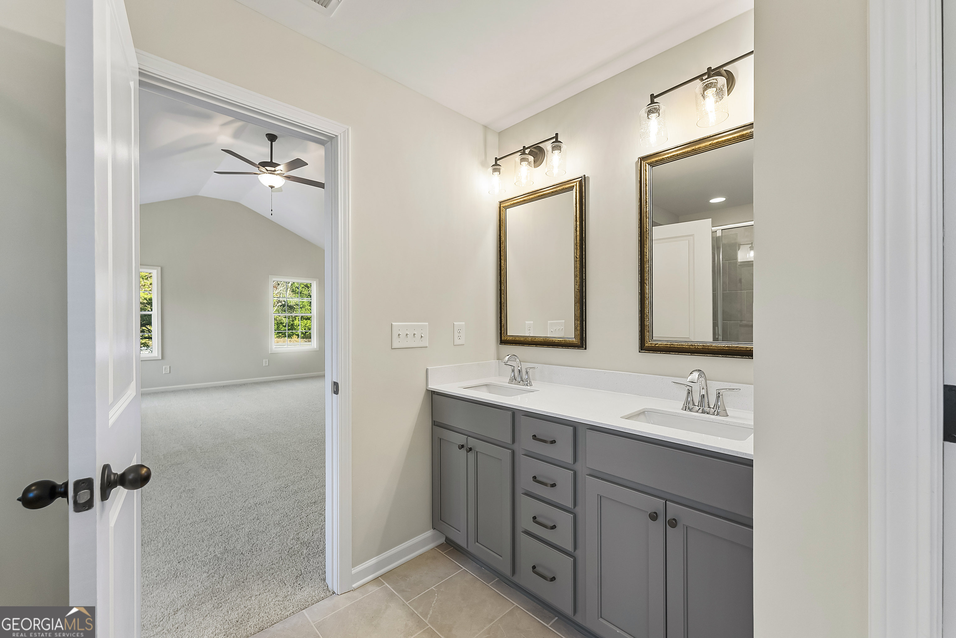 575 Mountain View Drive, Unit 17B Hamilton, GA 31811 - Photo 16 of 34 a bathroom with a double vanity sink and a mirror