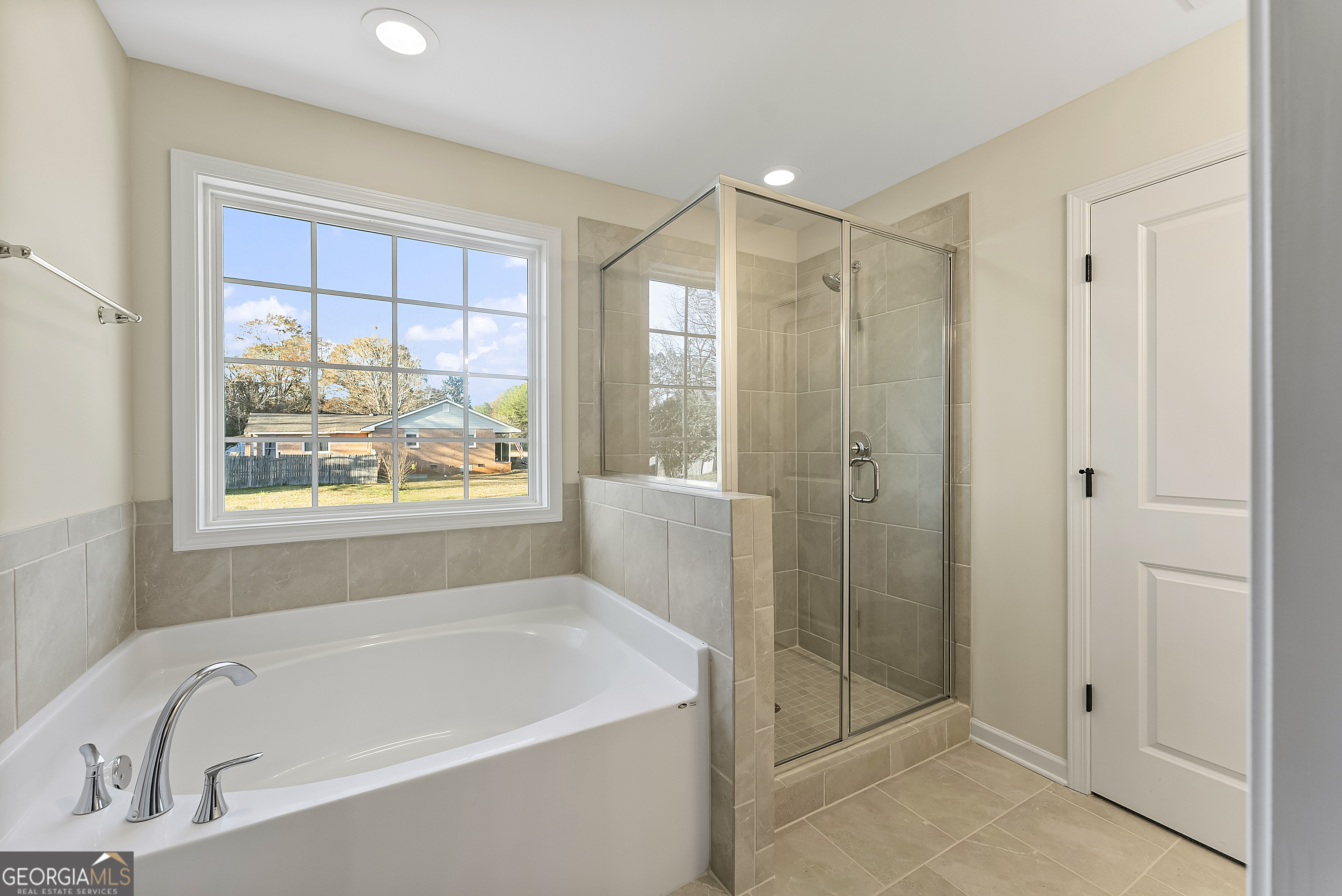 575 Mountain View Drive, Unit 17B Hamilton, GA 31811 - Photo 17 of 34 a bathroom with a large tub a shower and view