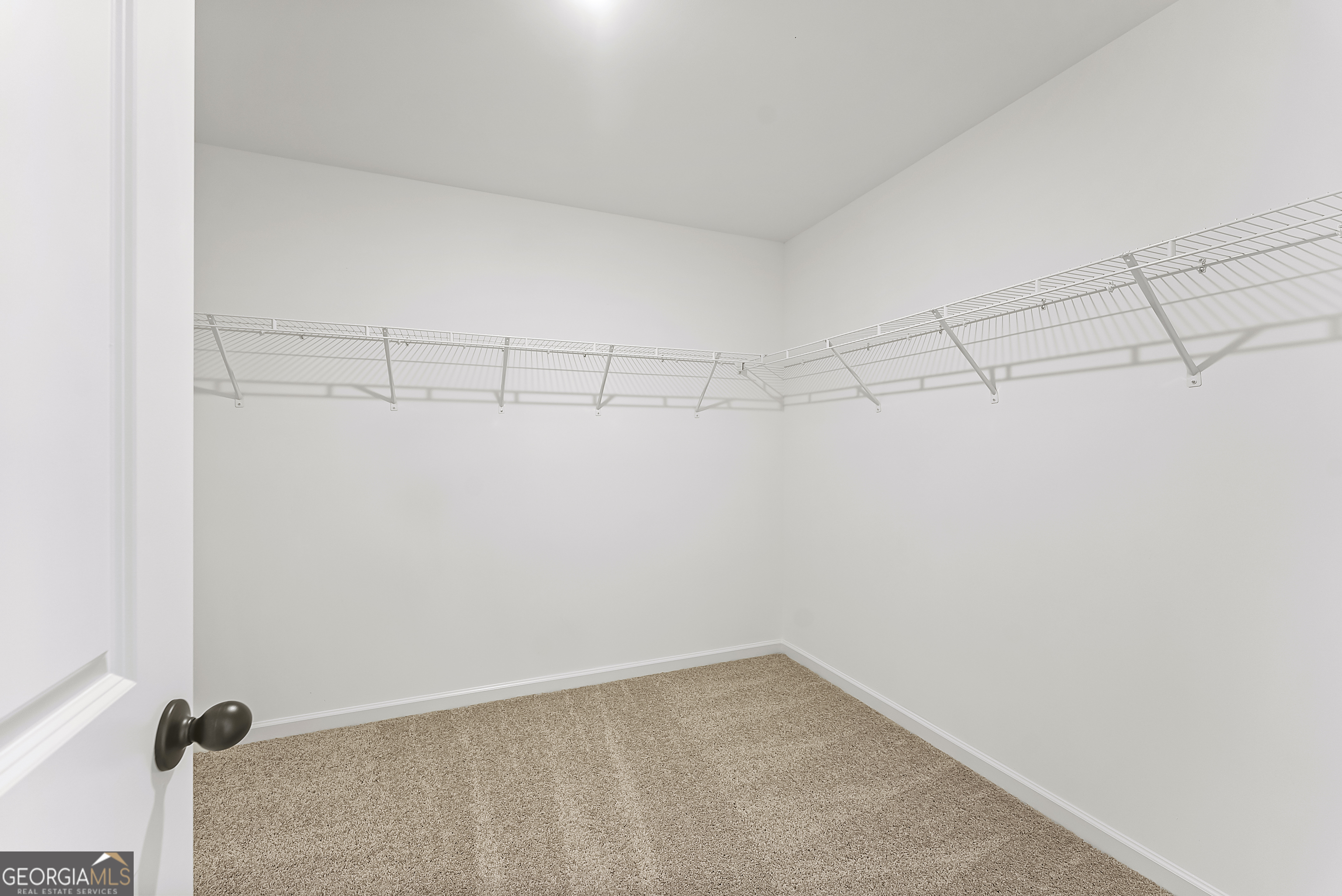 575 Mountain View Drive, Unit 17B Hamilton, GA 31811 - Photo 18 of 34 a view of a room with racks on the wall