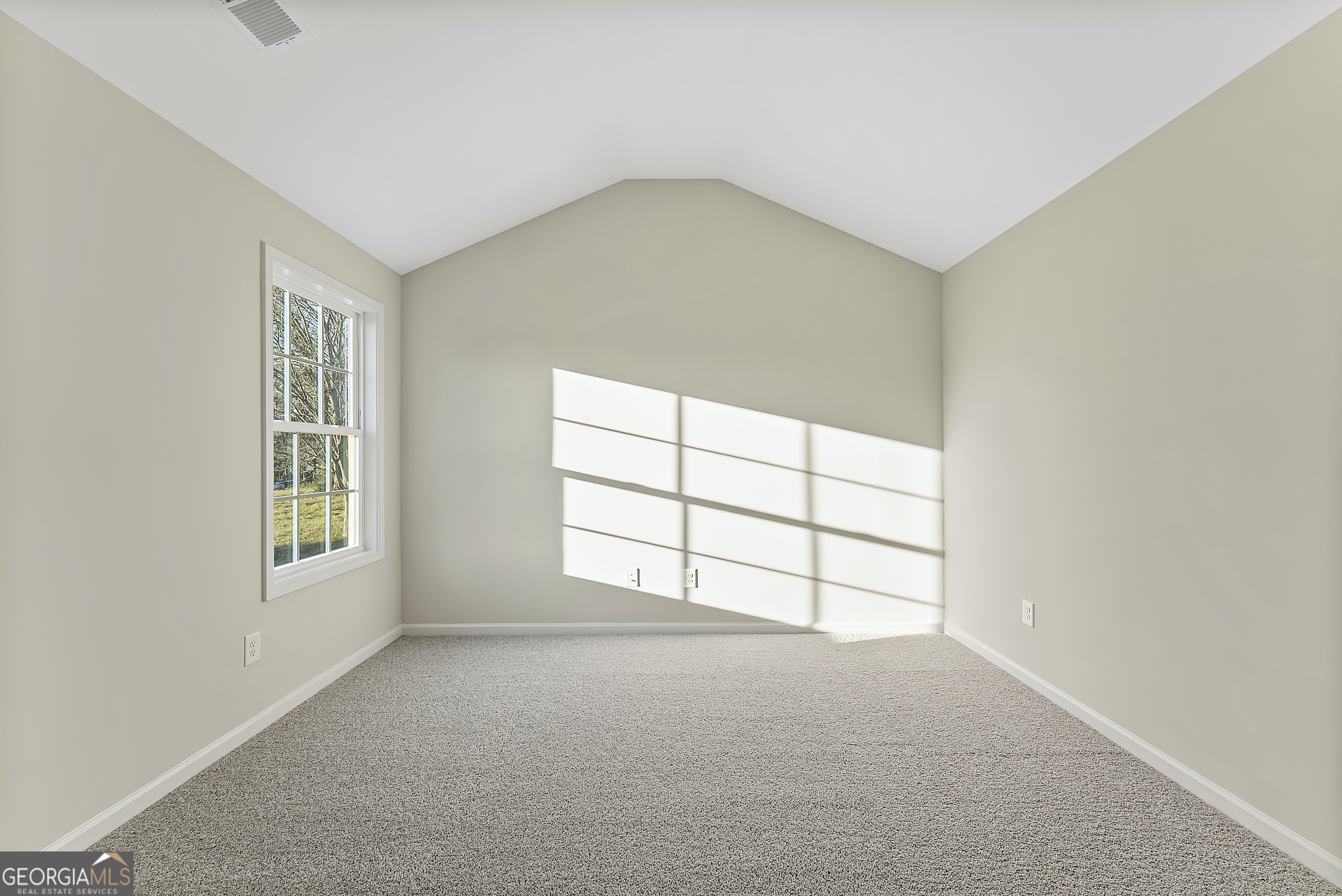 575 Mountain View Drive, Unit 17B Hamilton, GA 31811 - Photo 21 of 34 an empty room with windows