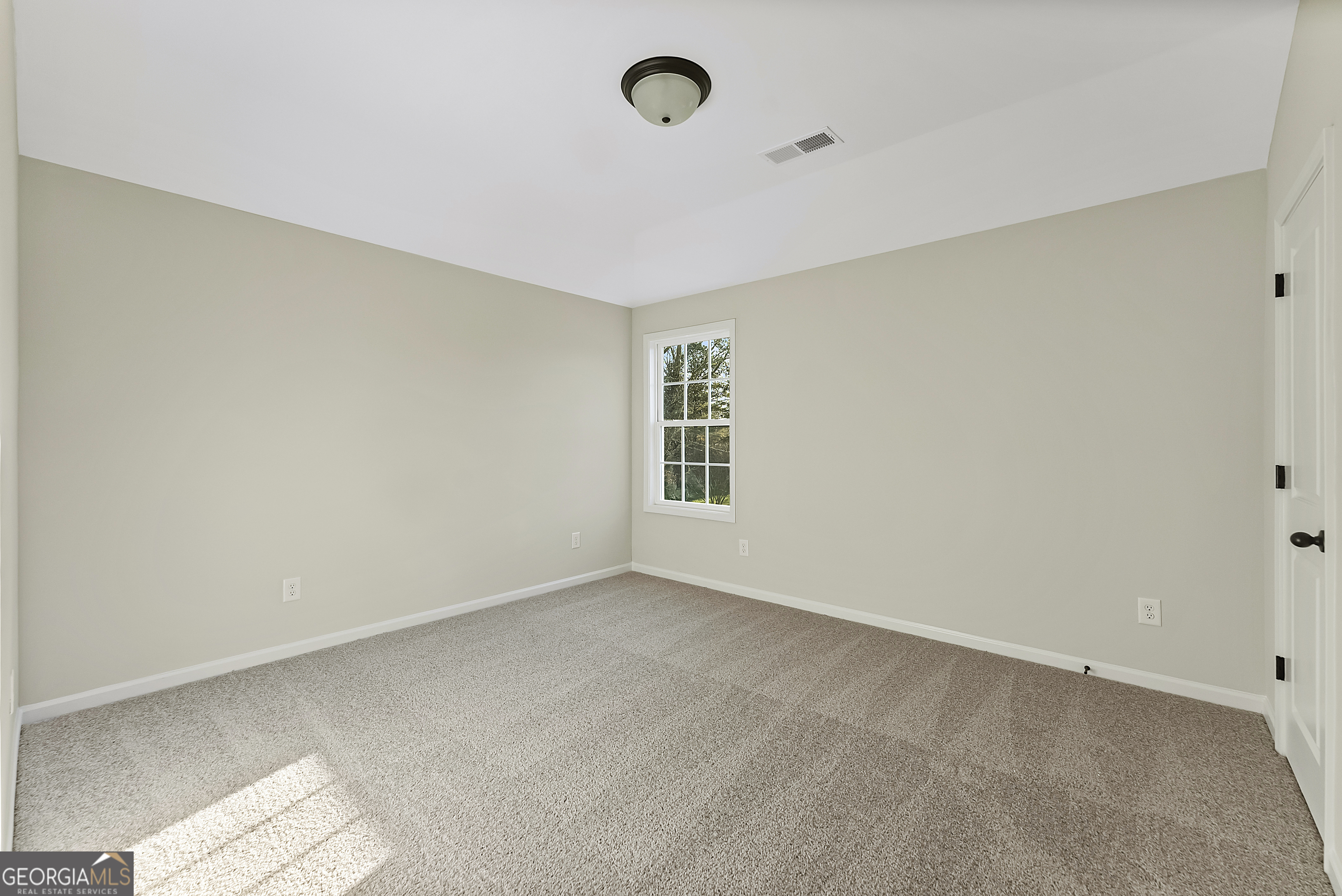 575 Mountain View Drive, Unit 17B Hamilton, GA 31811 - Photo 22 of 34 a view of an empty room with a window