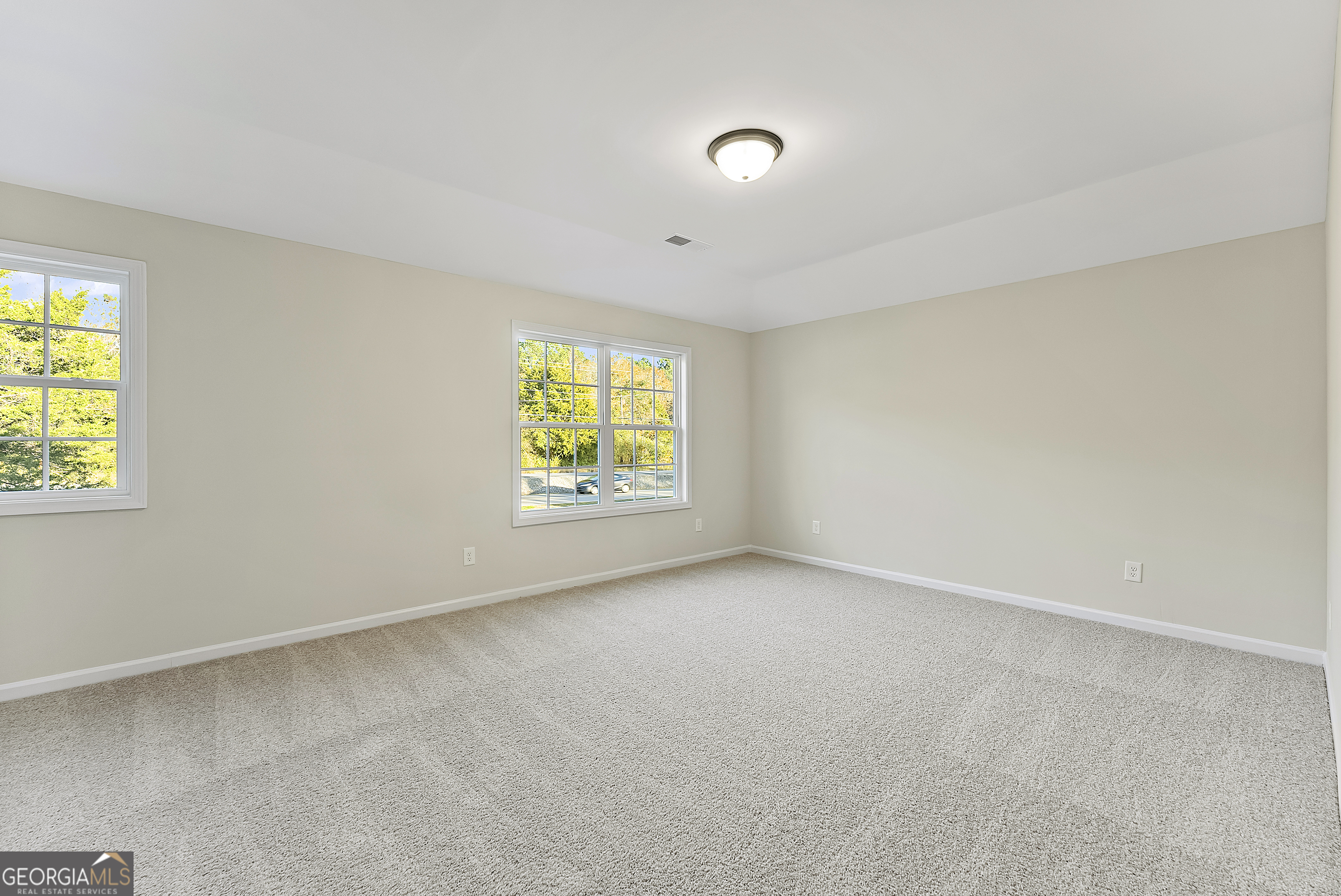 575 Mountain View Drive, Unit 17B Hamilton, GA 31811 - Photo 27 of 34 an empty room with windows
