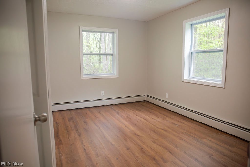 3644 Padanarum Road Geneva, OH 44041 - Photo 10 of 19 Room featuring wood-finish flooring, neutral wall tones, and white trim