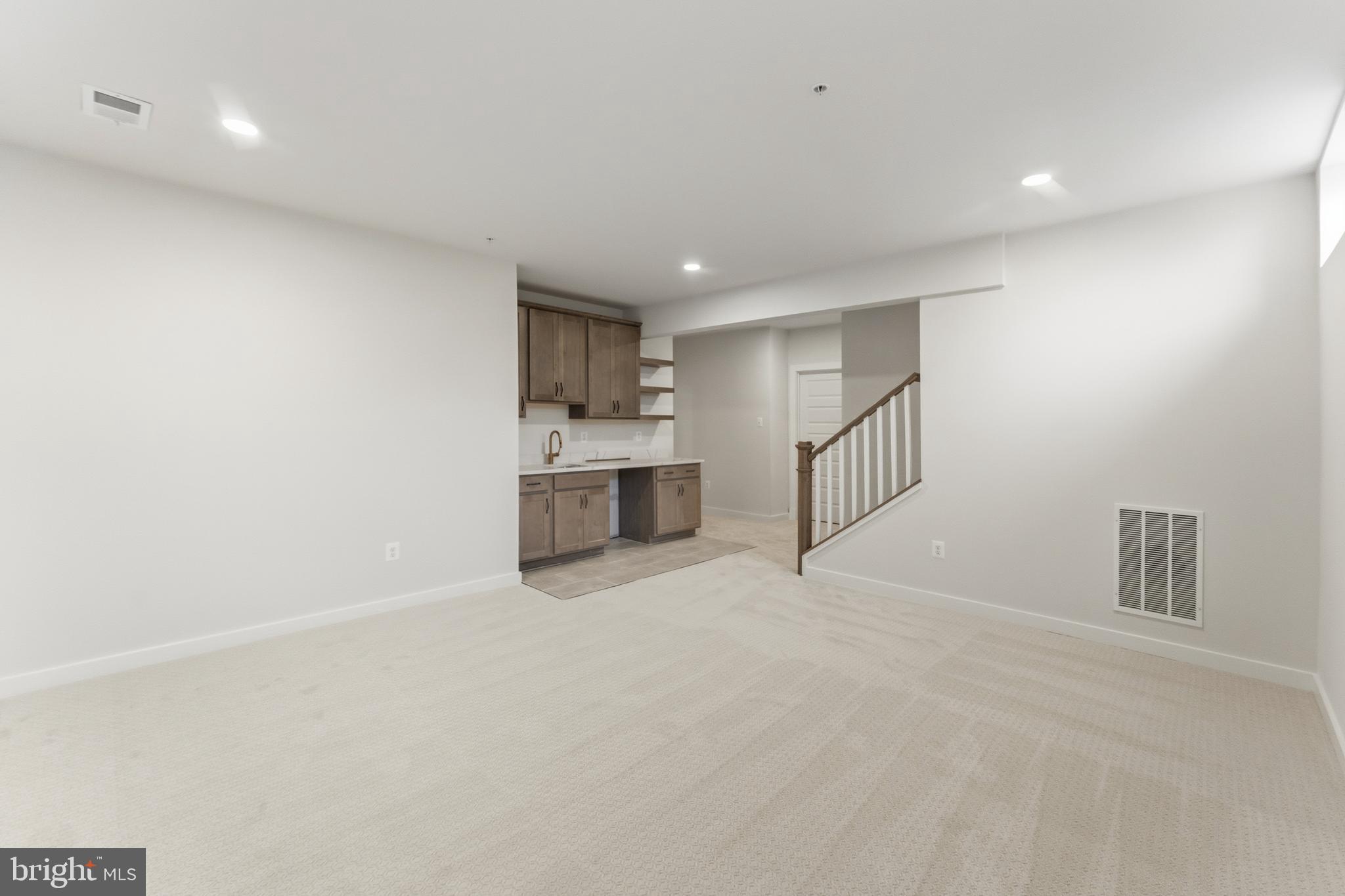 19110 Tatie Way Poolesville, MD 20837 - Photo 26 of 29 a view of an empty room with a kitchen