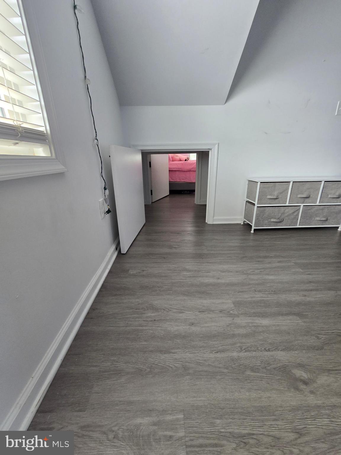 7513 Saffron Court Hanover, MD 21076 - Photo 21 of 42 a view of a room with wooden floor and window