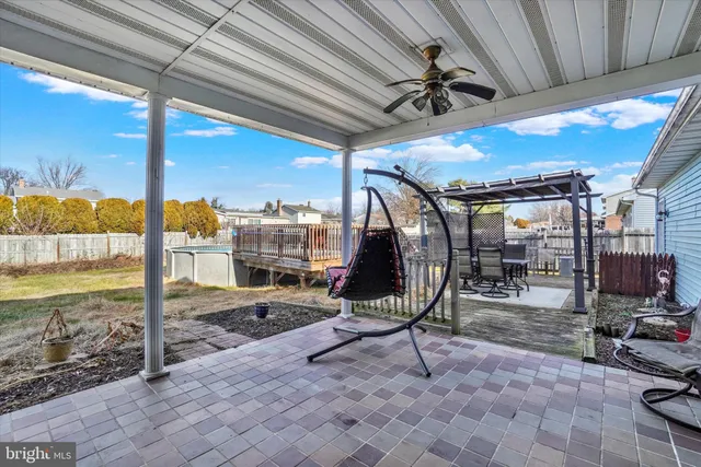 a view of a chairs and table in patio