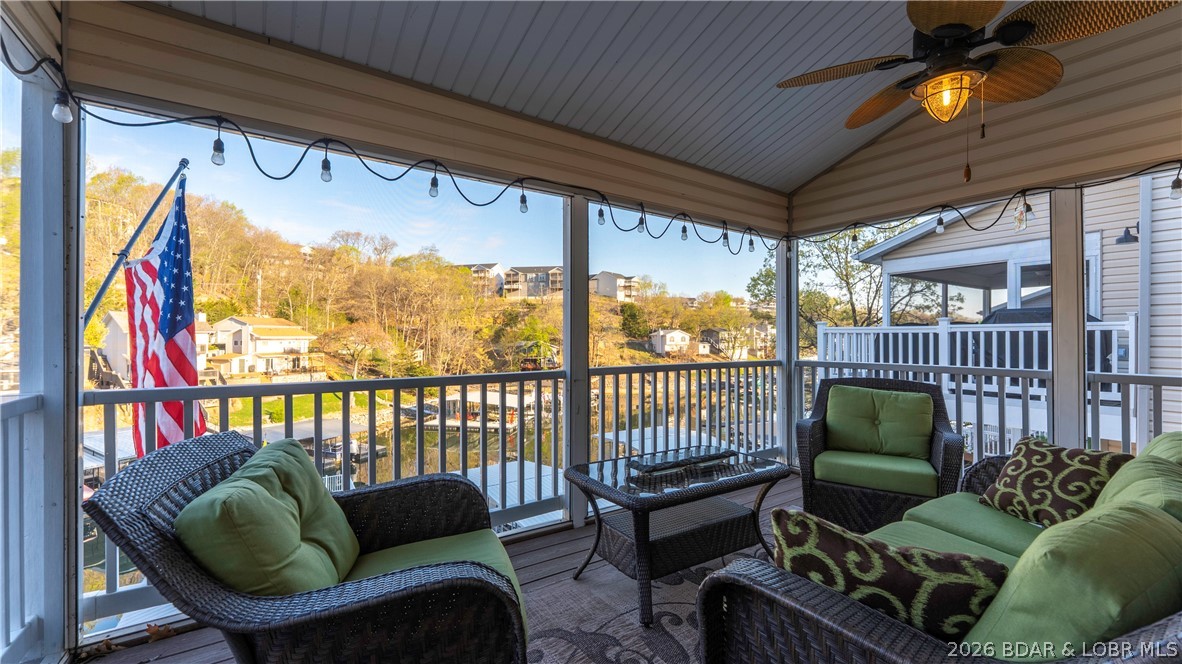 1453 Ginger Road Lake Ozark, MO 65049 - Photo 12 of 46 Upper level screened porch is perfect for lakeside