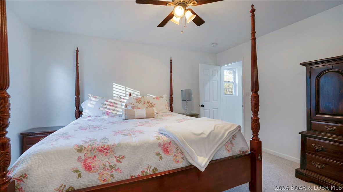 1453 Ginger Road Lake Ozark, MO 65049 - Photo 19 of 46 Welcoming upper level guest bedroom