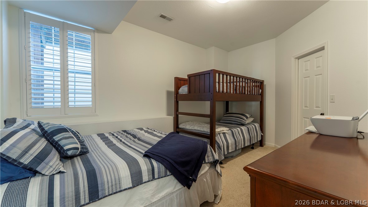 1453 Ginger Road Lake Ozark, MO 65049 - Photo 27 of 46 Guest bedroom with bunks