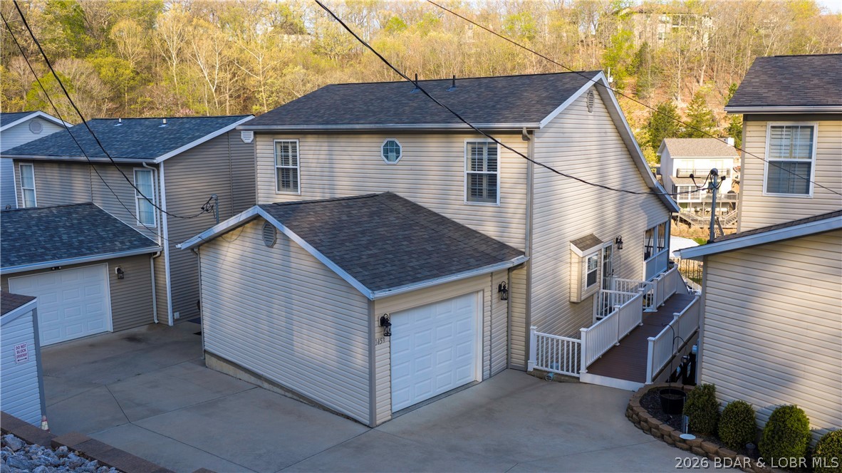 1453 Ginger Road Lake Ozark, MO 65049 - Photo 4 of 46 Easy access into your single garage and walk right