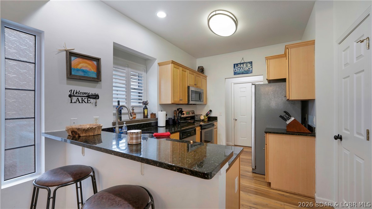 1453 Ginger Road Lake Ozark, MO 65049 - Photo 7 of 46 Kitchen features modern cabinets and granite tops