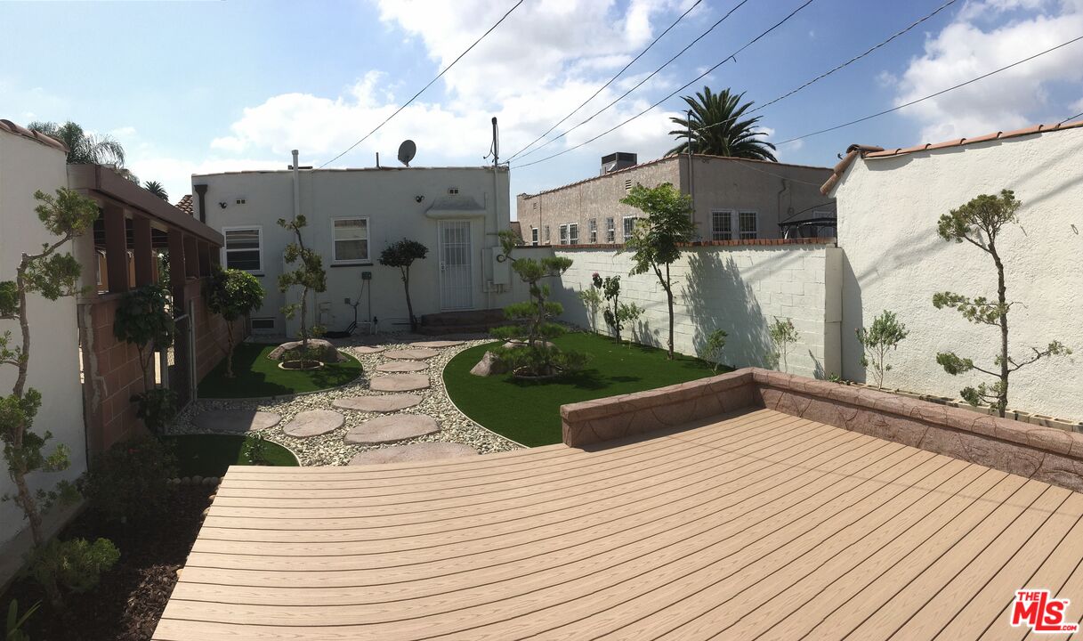 2107 West 84th Place Los Angeles, CA 90047 - Photo 23 of 25 a bathroom with a bathtub and shower