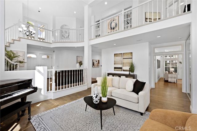a living room with furniture a fireplace and window