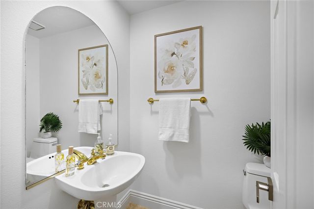 a view of a patio with couches and potted plants
