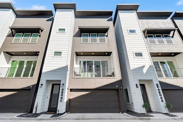 a front view of a house with glass windows