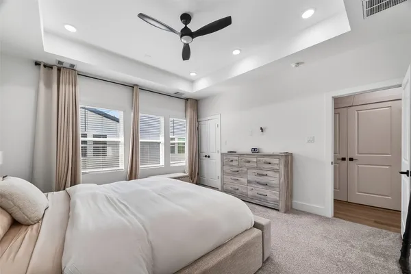 a bedroom with a bed and a dresser