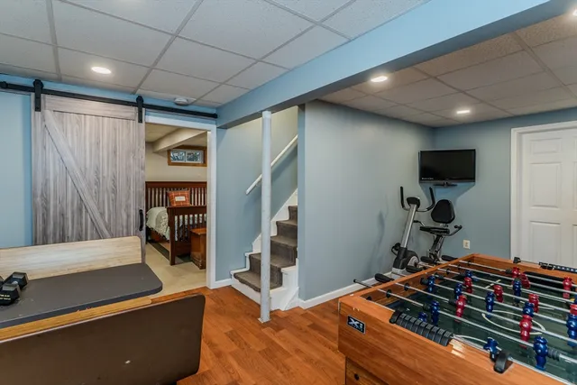 a bedroom with furniture and a flat screen tv