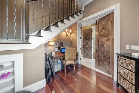 a aerial view of a house with a yard and potted plants