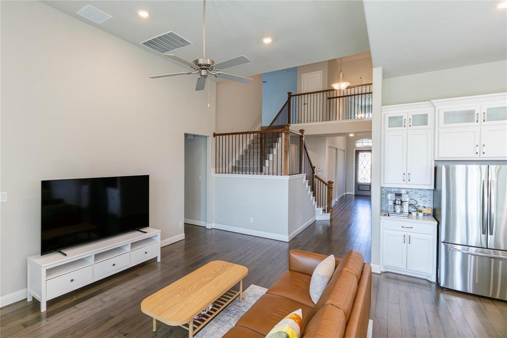 3920 Bentgrass Road Plano, TX 75023 - Photo 17 of 30 a living room with furniture and a flat screen tv