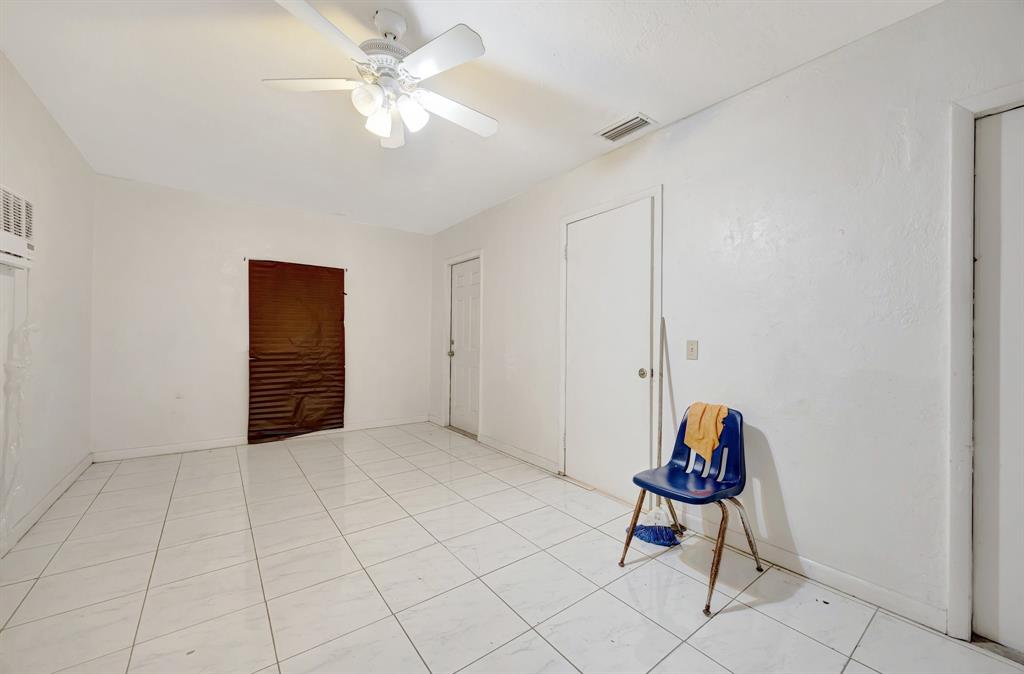 Palmetto Estates Miami, FL 33157 - Photo 40 of 48 a view of a room with cabinet and a chandelier fan