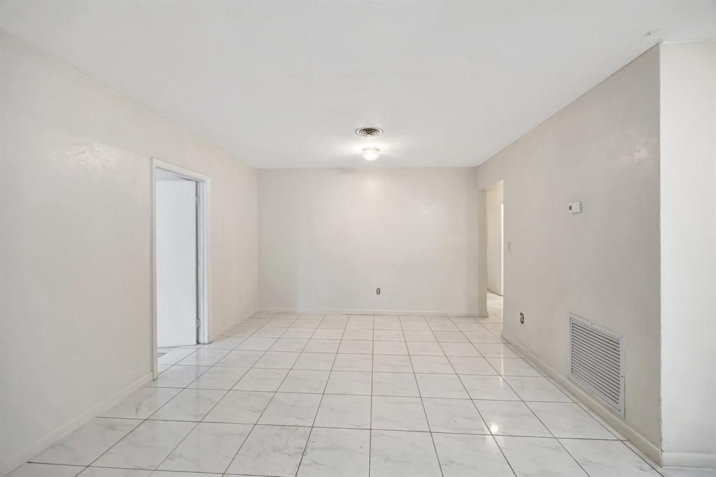 Palmetto Estates Miami, FL 33157 - Photo 8 of 48 an empty room with white walls and tiles