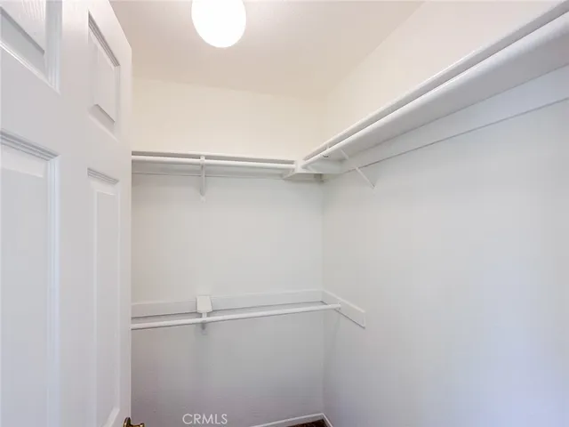 a bathroom with a sink a vanity and a shower curtain