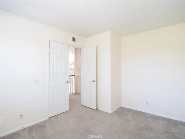 a view of a street with a bench in the background
