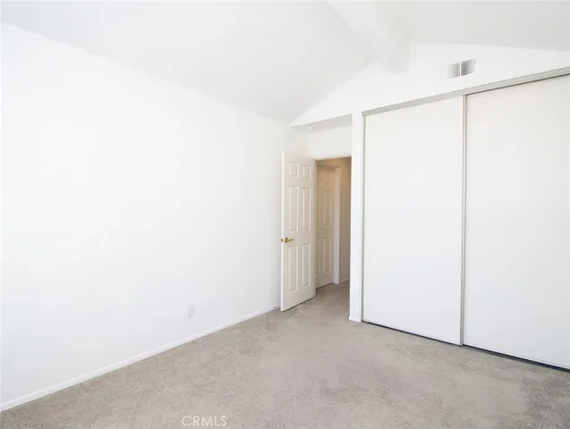 a view of a street with trees on both side of it