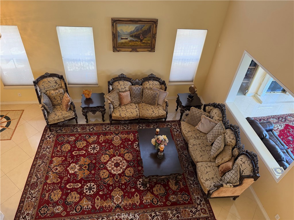19823 Mariposa Pines Way Porter Ranch, CA 91326 - Photo 22 of 50 a living room with furniture and wooden floor