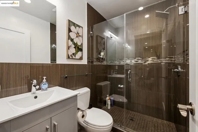 a large kitchen with kitchen island a stove a sink a dining table and chairs