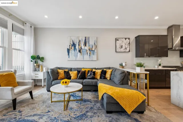 a view of staircase with wooden floor and fan