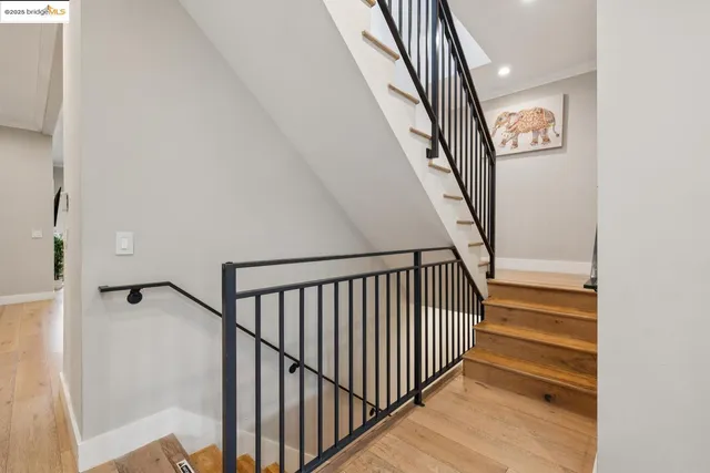 a kitchen with kitchen island wooden cabinets and refrigerator