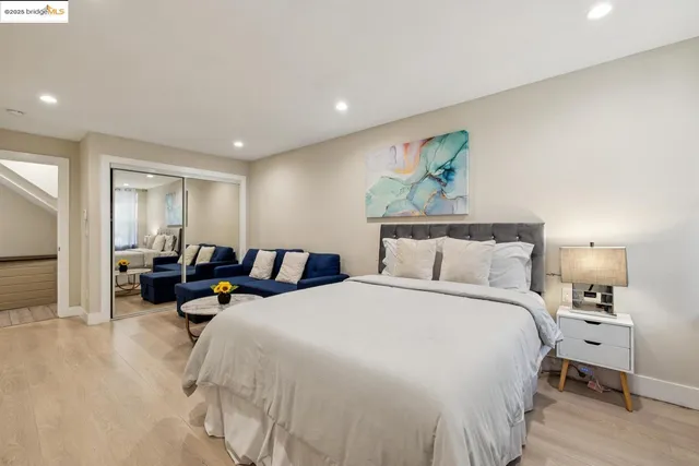 a kitchen with stainless steel appliances granite countertop a sink and a refrigerator