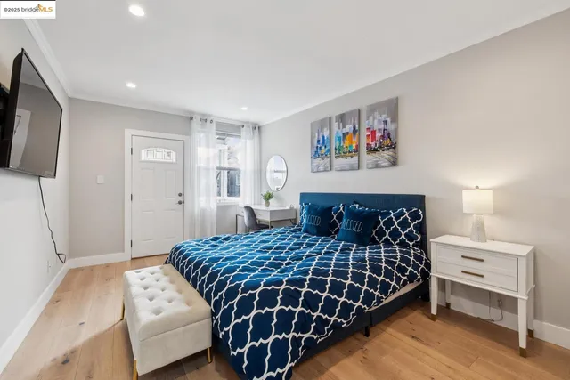 a bathroom with a toilet a sink a mirror and vanity