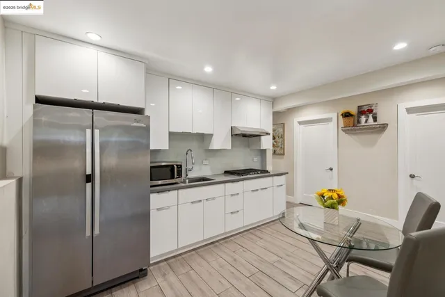a kitchen with granite countertop a stove and a sink