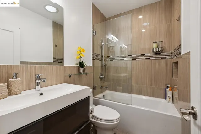 a bathroom with a double vanity sink a mirror and shower