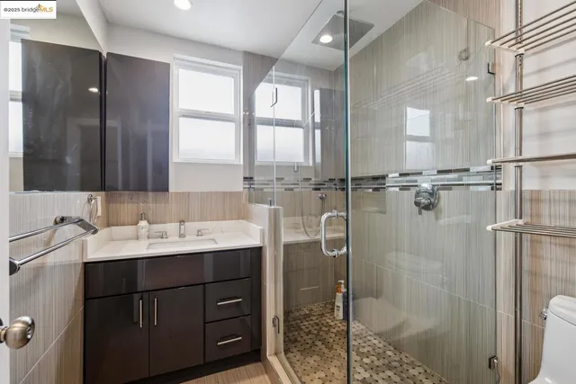 a kitchen with stainless steel appliances a refrigerator and sink