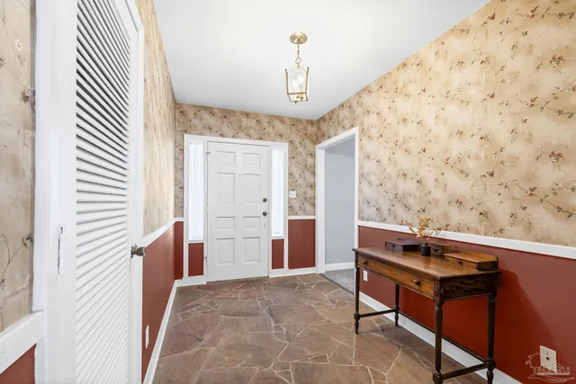 a view of a dining room with furniture window and outside view