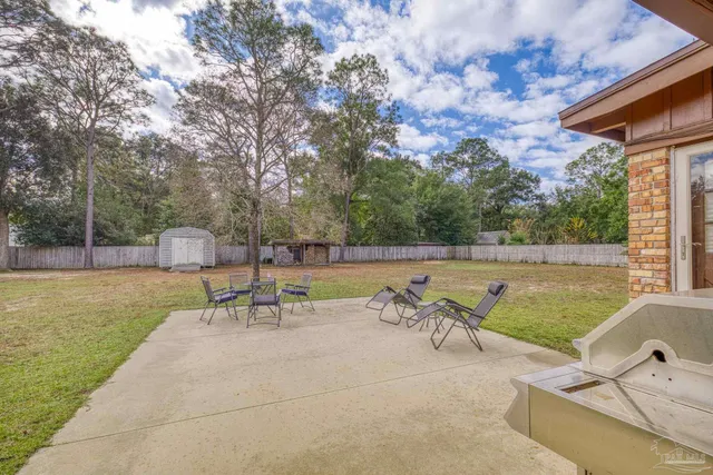 a view of a field with trees