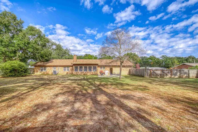 a backyard of a house with lots of green space