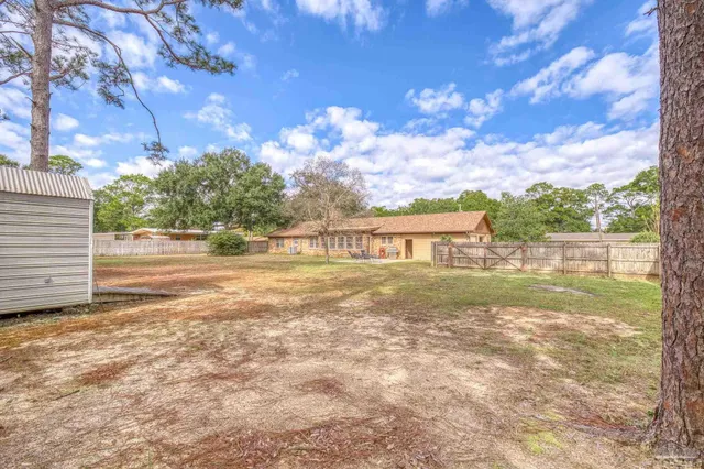 a view of a front door and wooden door