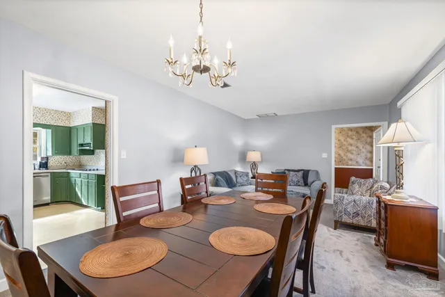 a kitchen with stainless steel appliances granite countertop a refrigerator and a stove