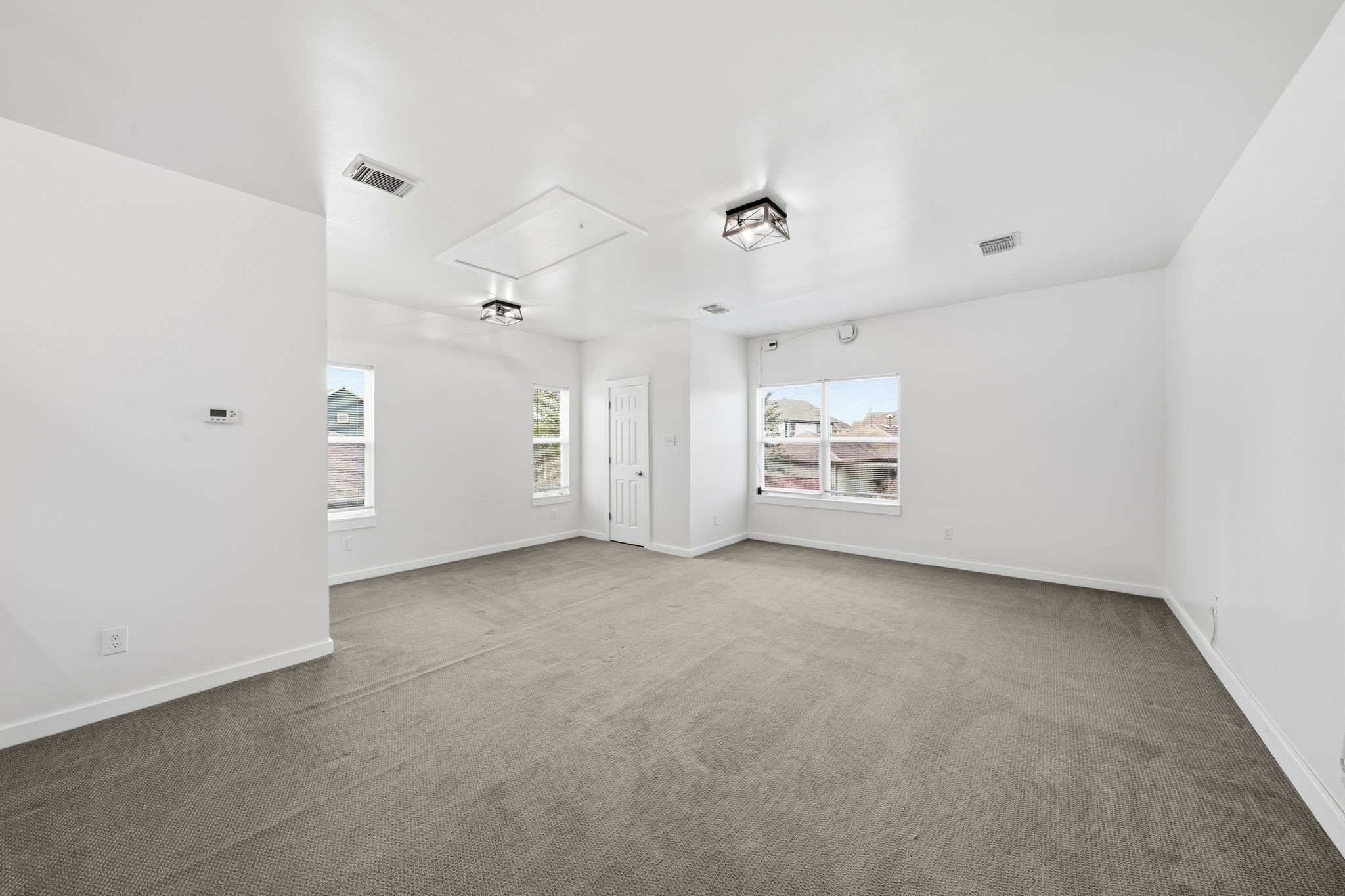17019 Seminole Ridge Drive Cypress, TX 77433 - Photo 31 of 48 Private bedroom located in separate living quarters, featuring plush carpet and abundant natural light. Spacious layout offers flexibility and comfort—ideal for guests, multigenerational living, or a private retreat.