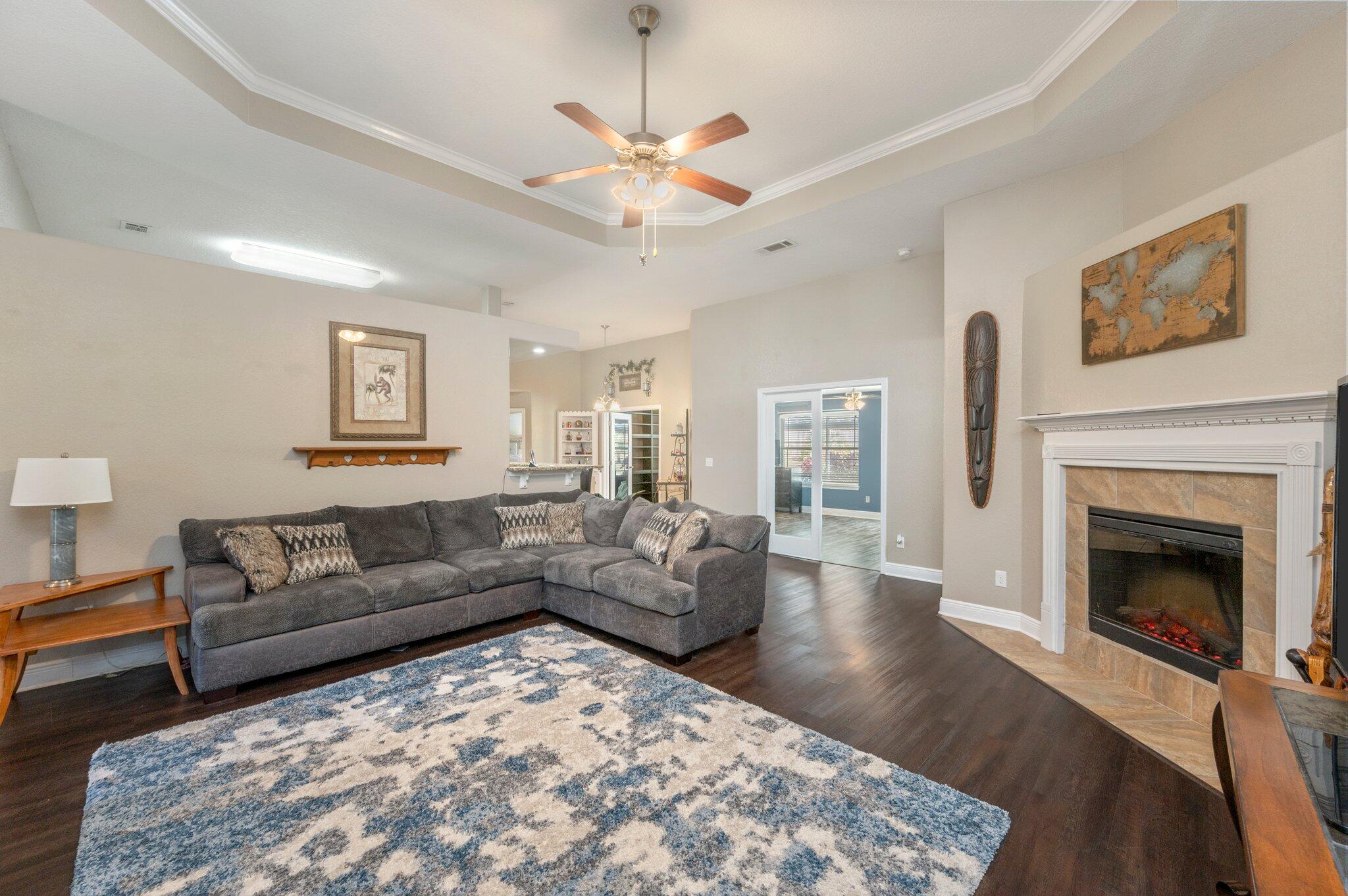 6262 Evan Circle Crestview, FL 32536 - Photo 13 of 45 a living room with furniture and a fireplace