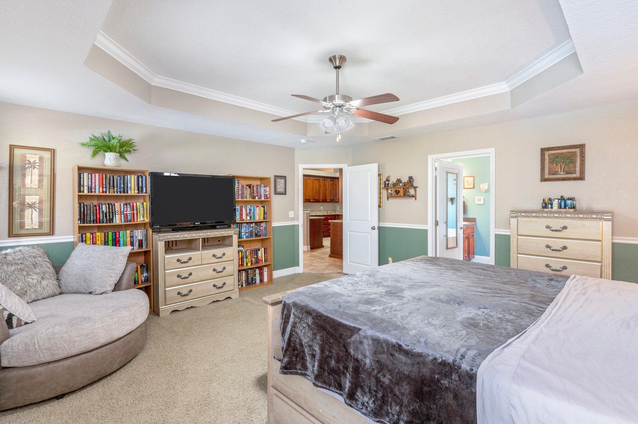 6262 Evan Circle Crestview, FL 32536 - Photo 22 of 45 a living room with furniture and a flat screen tv