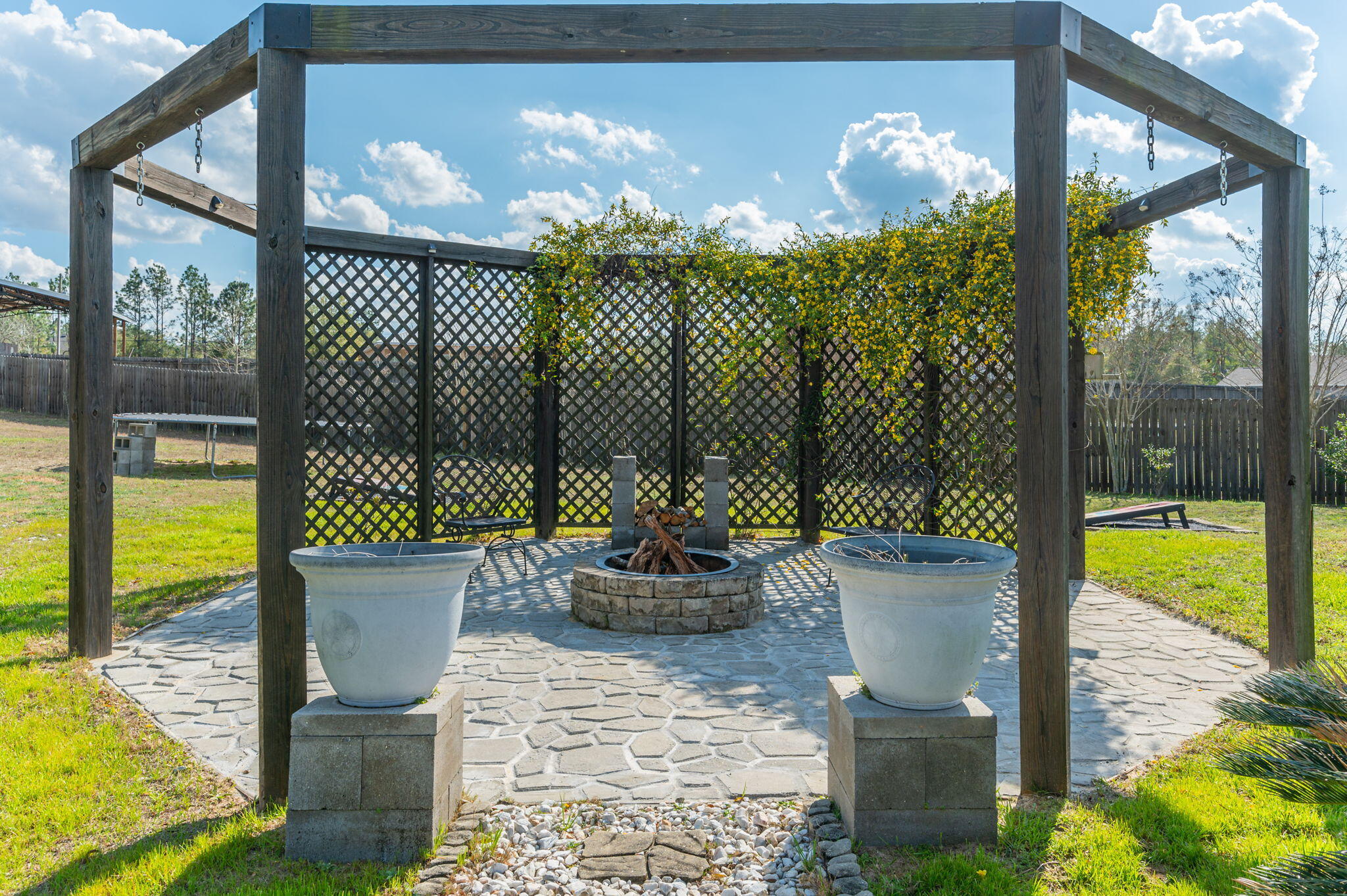 6262 Evan Circle Crestview, FL 32536 - Photo 3 of 45 a view of a chair and tables in the patio