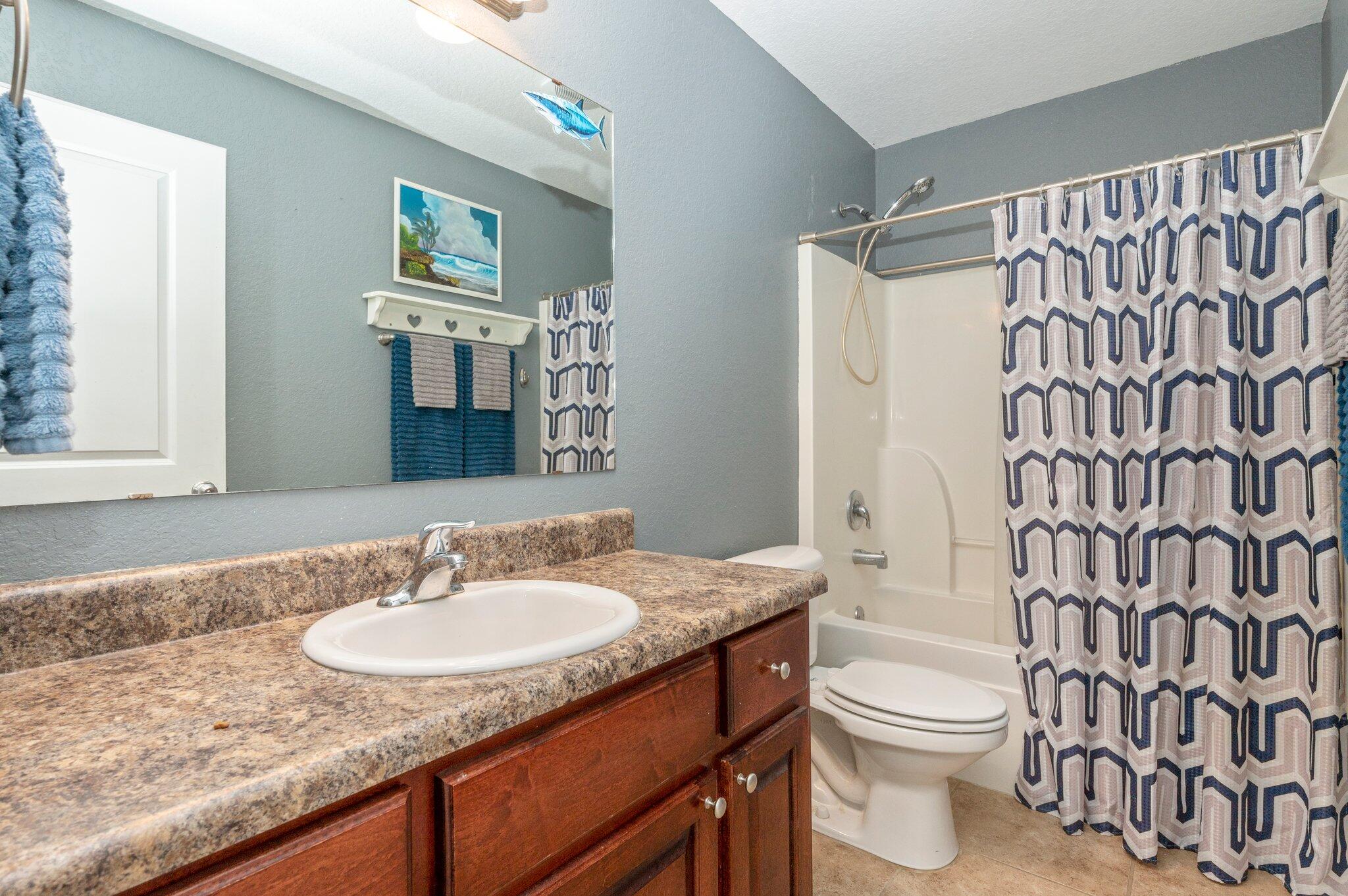 6262 Evan Circle Crestview, FL 32536 - Photo 32 of 45 a bathroom with a granite countertop sink toilet and shower